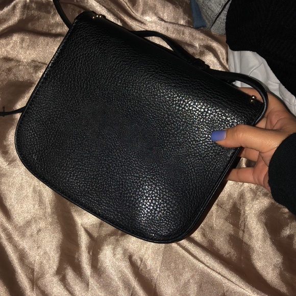 I am selling a black crossover body Aldo bag. - Picture 2 of 3